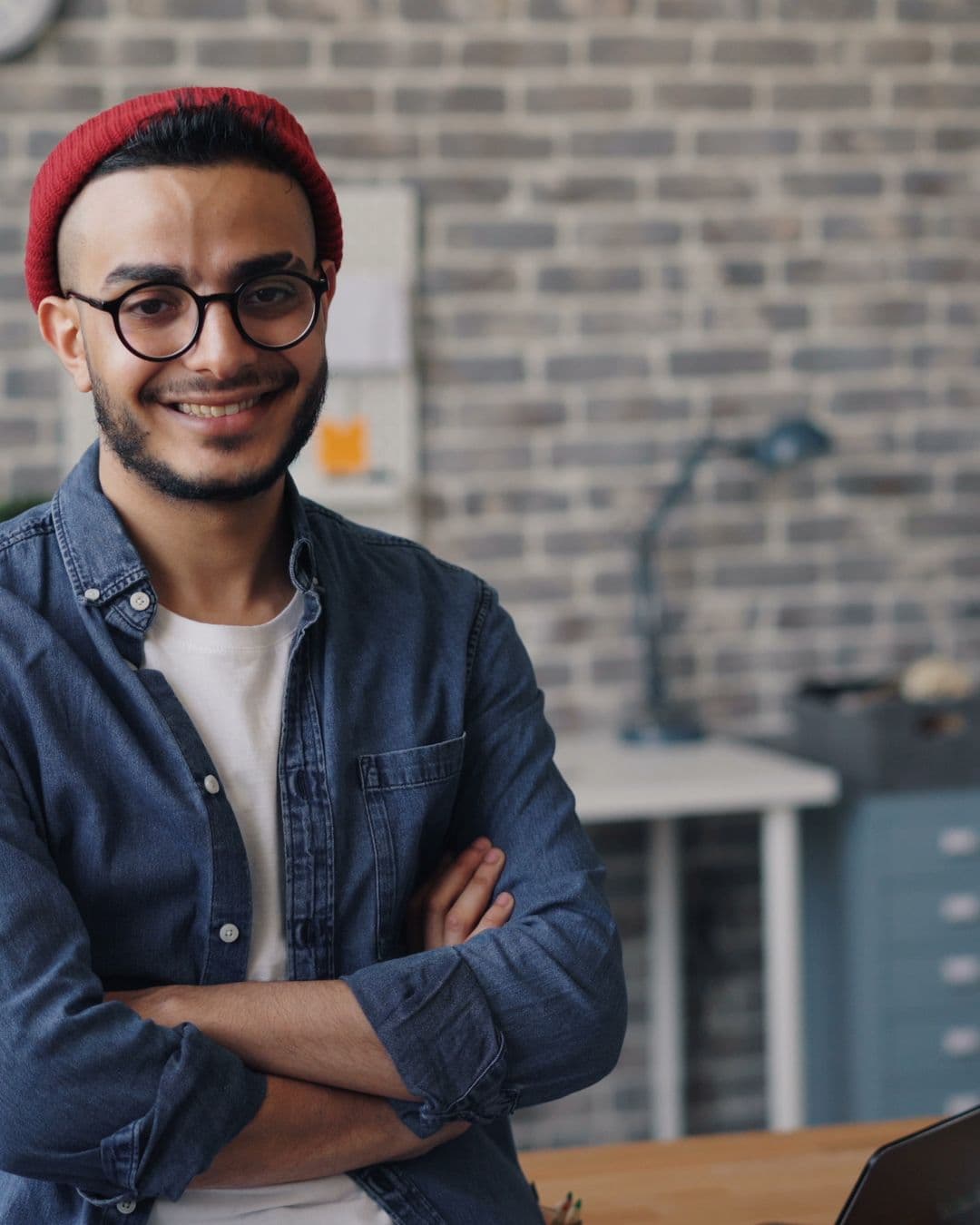 A small-business owner standing in their workplace